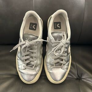 Veja low top leather metallic sneakers, silver with round toe.